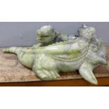 A large carved Chinese jade model of two entwined crocodiles, tail and back claw a/f, 66cm, 35kg **