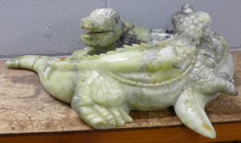 A large carved Chinese jade model of two entwined crocodiles, tail and back claw a/f, 66cm, 35kg **