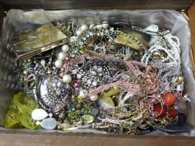 A wicker basket of costume jewellery