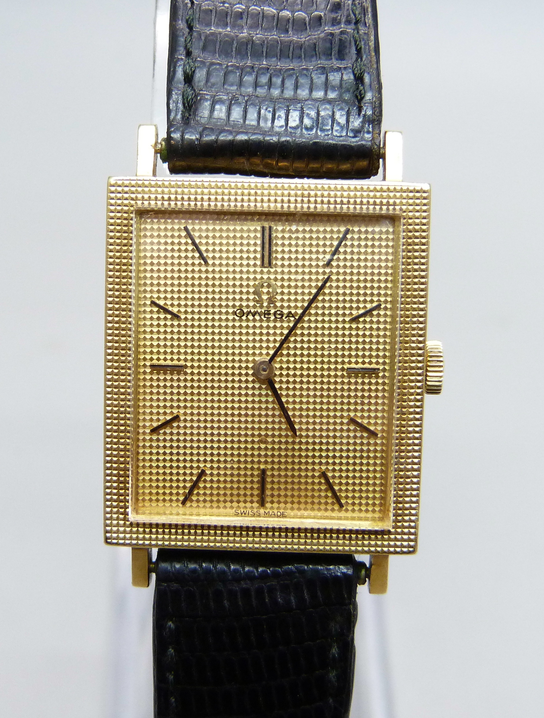 A gentleman's 18ct gold cased Omega dress wristwatch on a leather watch strap with Omega buckle,