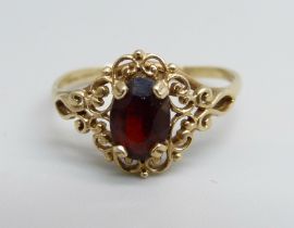 A 9ct gold and red stone ring, 1.3g, M/N