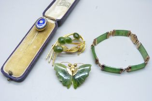 A silver set jade bracelet, two jade set brooches and an enamelled pin