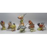 A collection of eight Beswick and Royal Worcester models of birds