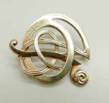 A 9ct gold Arts and Crafts Ola Gorie brooch, 7.3g, 34mm wide