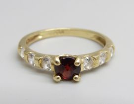 A 9ct gold, garnet and white stone ring, 2.1g, N