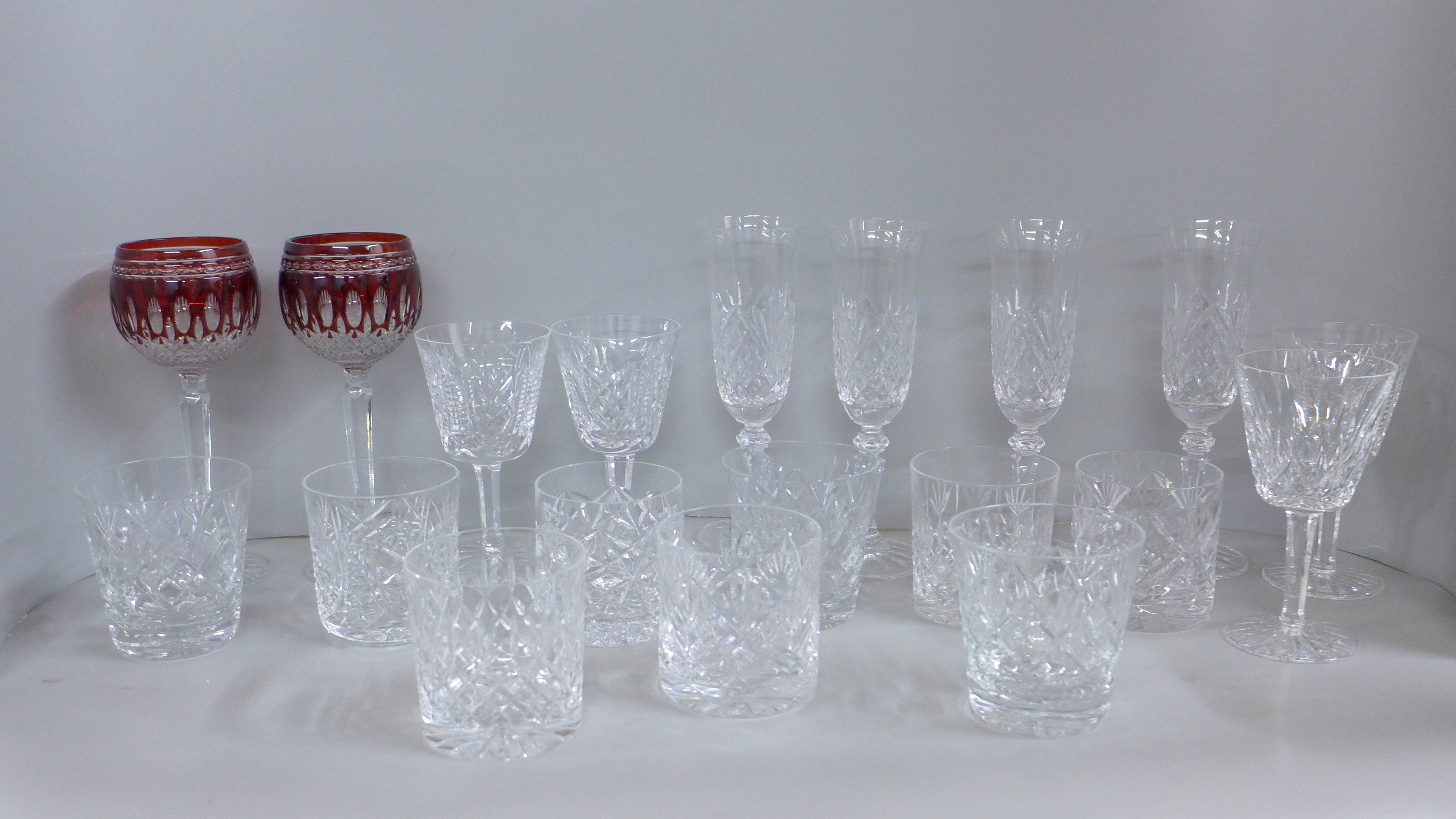 A collection of lead crystal glass including four Galway champagne flutes, four Waterford Crystal
