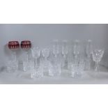 A collection of lead crystal glass including four Galway champagne flutes, four Waterford Crystal