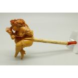 A carved Meerschaum pipe of a scantily clad young lady, with bone stem separate, cased