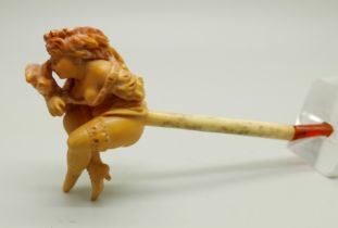 A carved Meerschaum pipe of a scantily clad young lady, with bone stem separate, cased