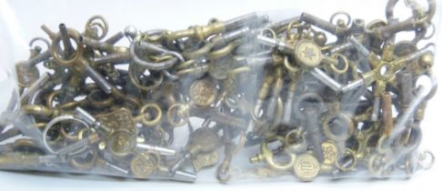 A large collection of watch keys including advertising