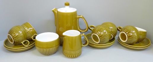 A Langley Pottery coffee set; six cups, six saucers, a milk jug, sugar bowl and coffee pot