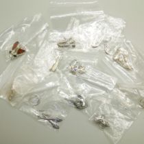 Twelve pairs of silver earrings