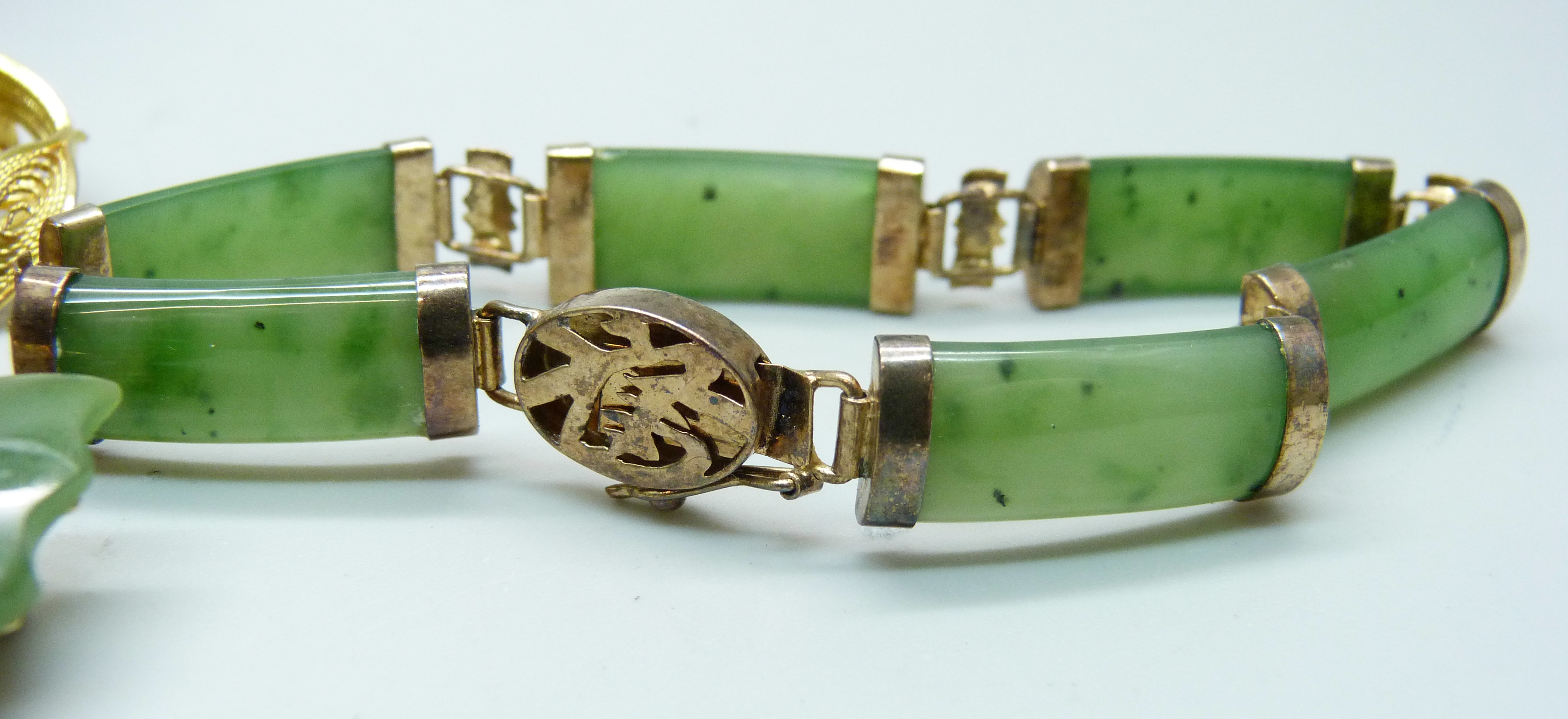 A silver set jade bracelet, two jade set brooches and an enamelled pin - Image 2 of 7