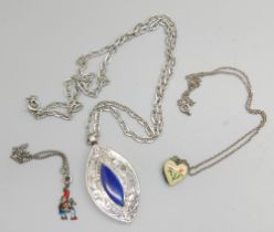 A silver pendant, a silver and enamelled locket and a silver bracelet with enamelled charm