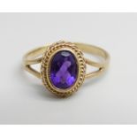 A 9ct gold and amethyst ring, 1.4g, K