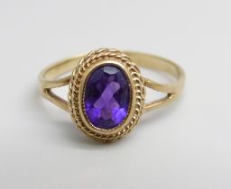 A 9ct gold and amethyst ring, 1.4g, K