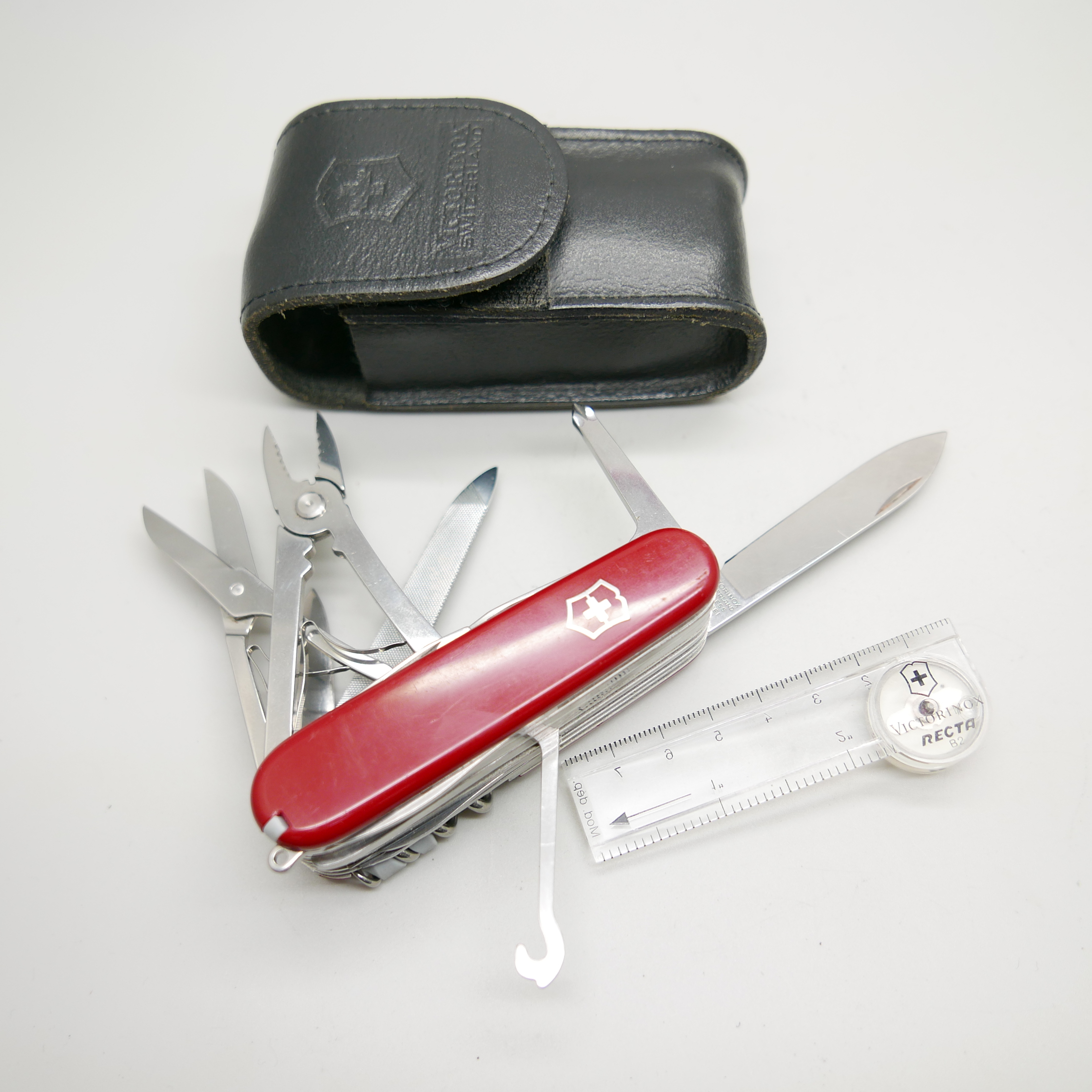A Victorinox Swiss multi-tool knife, 22 tools and with a compass, with leather case