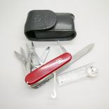 A Victorinox Swiss multi-tool knife, 22 tools and with a compass, with leather case