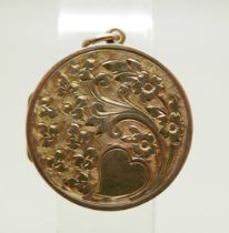 A yellow metal circular engraved locket, 23mm