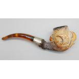 An early 20th Century eagle's claw, pipe, with amber stem and silver collar, cased Meeerschaum