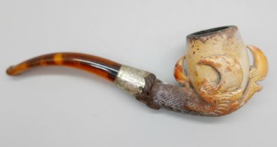 An early 20th Century eagle's claw, pipe, with amber stem and silver collar, cased Meeerschaum