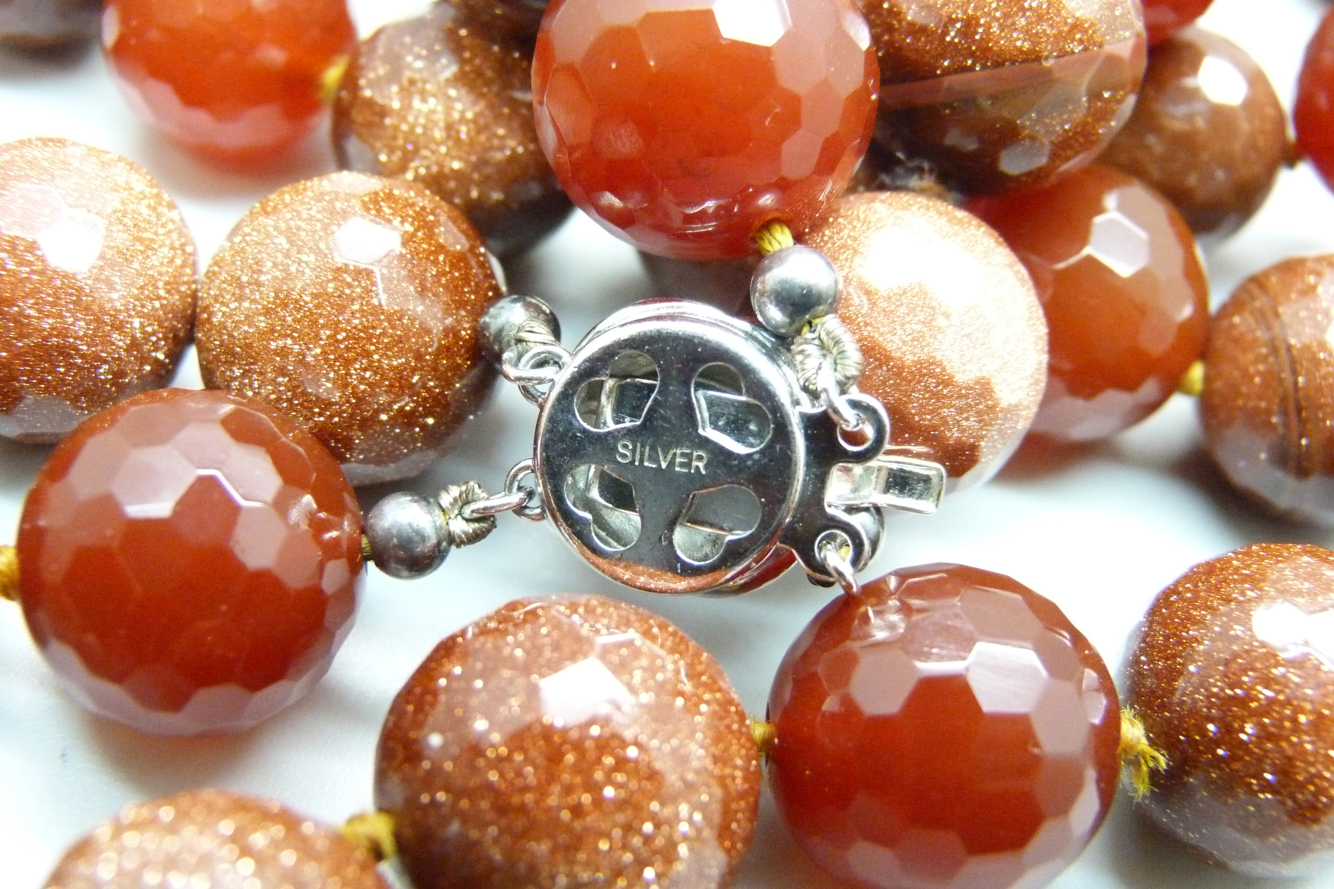 A heavy faceted goldstone and dark red stone bead double string necklace with silver clasp, 278g - Image 4 of 4