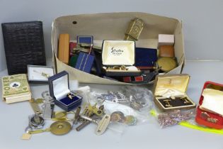 A collection of men's cufflinks, coins, a farrier's vintage horse shoe pen knife, watch and clock