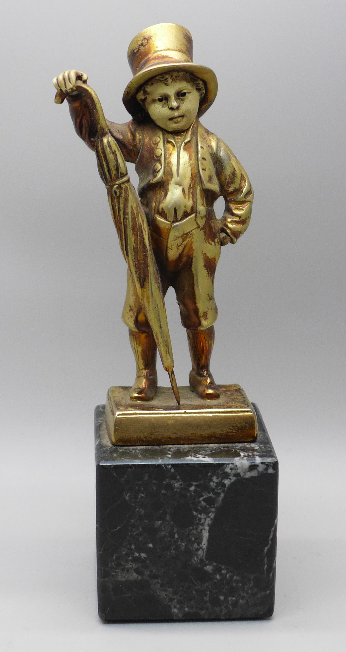 An Art Deco style gilt metal figure of a street urchin, after Mehnert on a marble base, 17cm