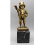 An Art Deco style gilt metal figure of a street urchin, after Mehnert on a marble base, 17cm