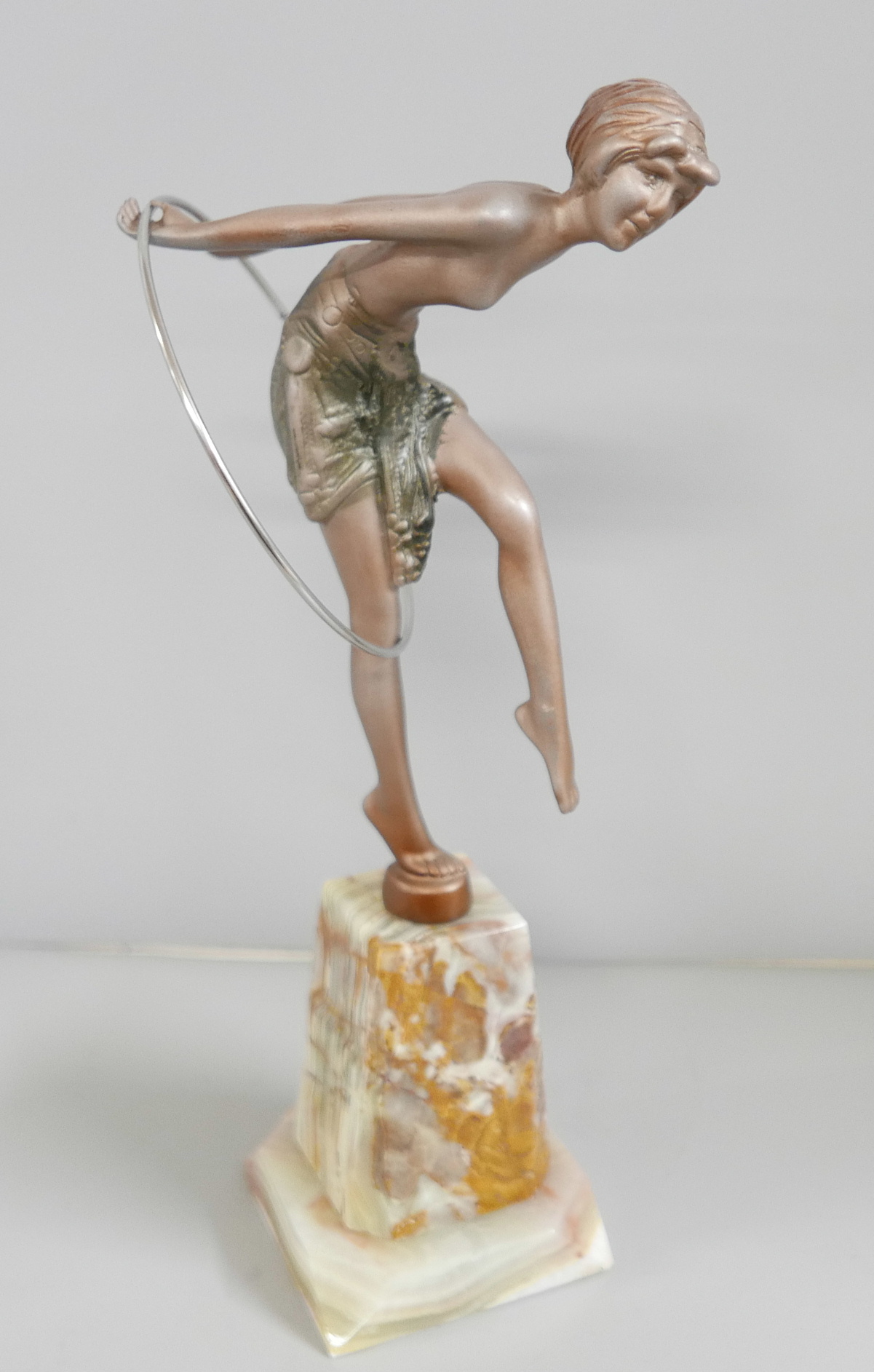 An Art Deco style figure, Hoop Girl, after, F. Preiss, on an onyx base, 30.5cm