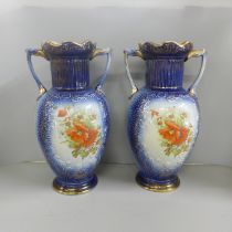 A pair of large blue pottery transfer printed vases with floral decoration, 35cm **PLEASE NOTE