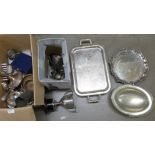 Two boxes of plated ware including a pair of candlesticks, two plated trays, napkin rings, silver