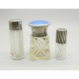 Three silver topped scent bottles; small scent London 1887, with inscription