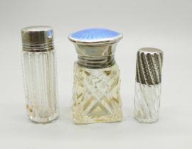 Three silver topped scent bottles; small scent London 1887, with inscription