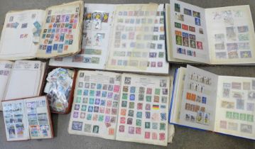 A box of seven albums of stamps and a tin of loose stamps
