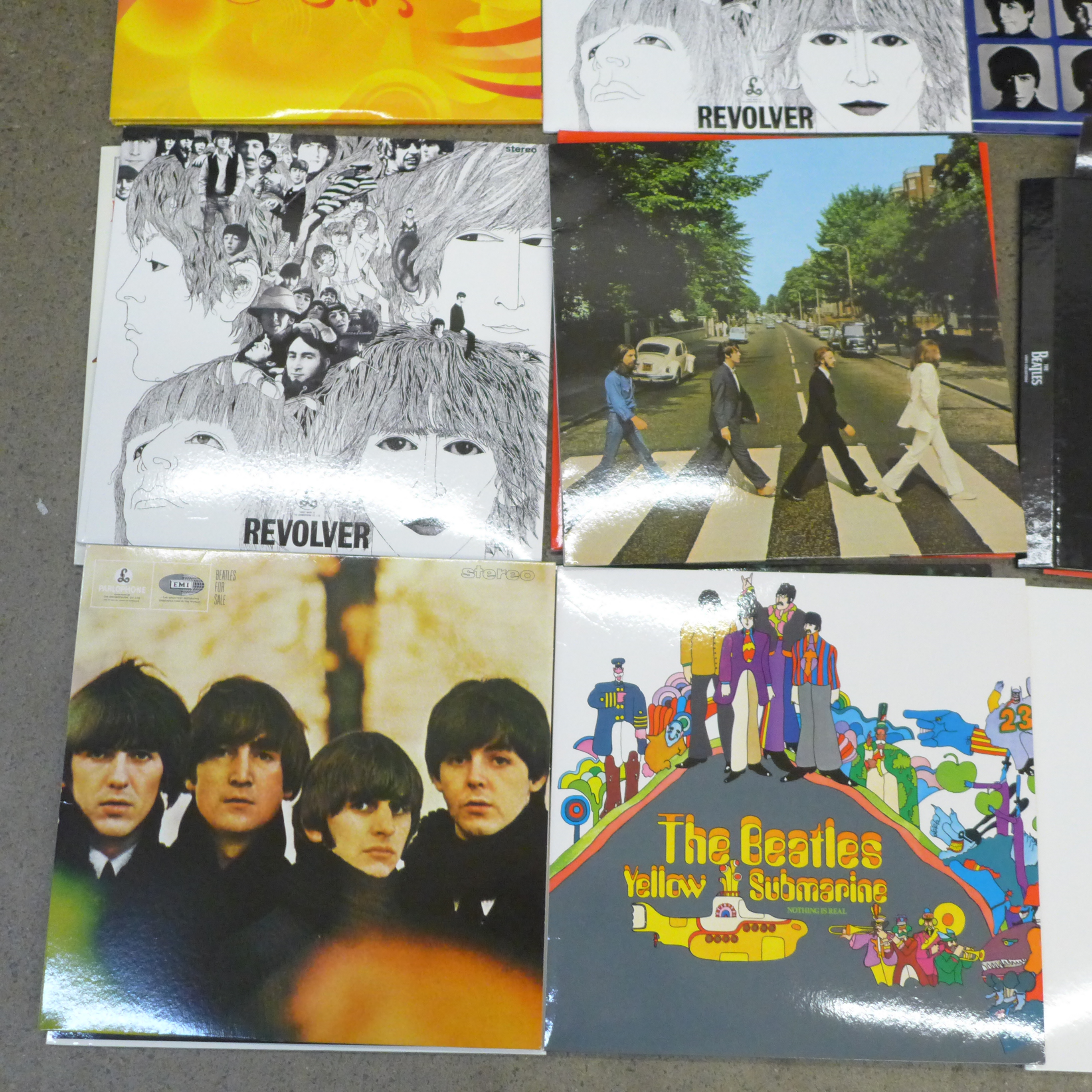 Twelve The Beatles LP records, re-issues, in VG condition, (Revolver x2 and Love album) folder and - Image 2 of 2