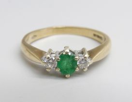 A 9ct gold, diamond and emerald ring, 2.5g, M