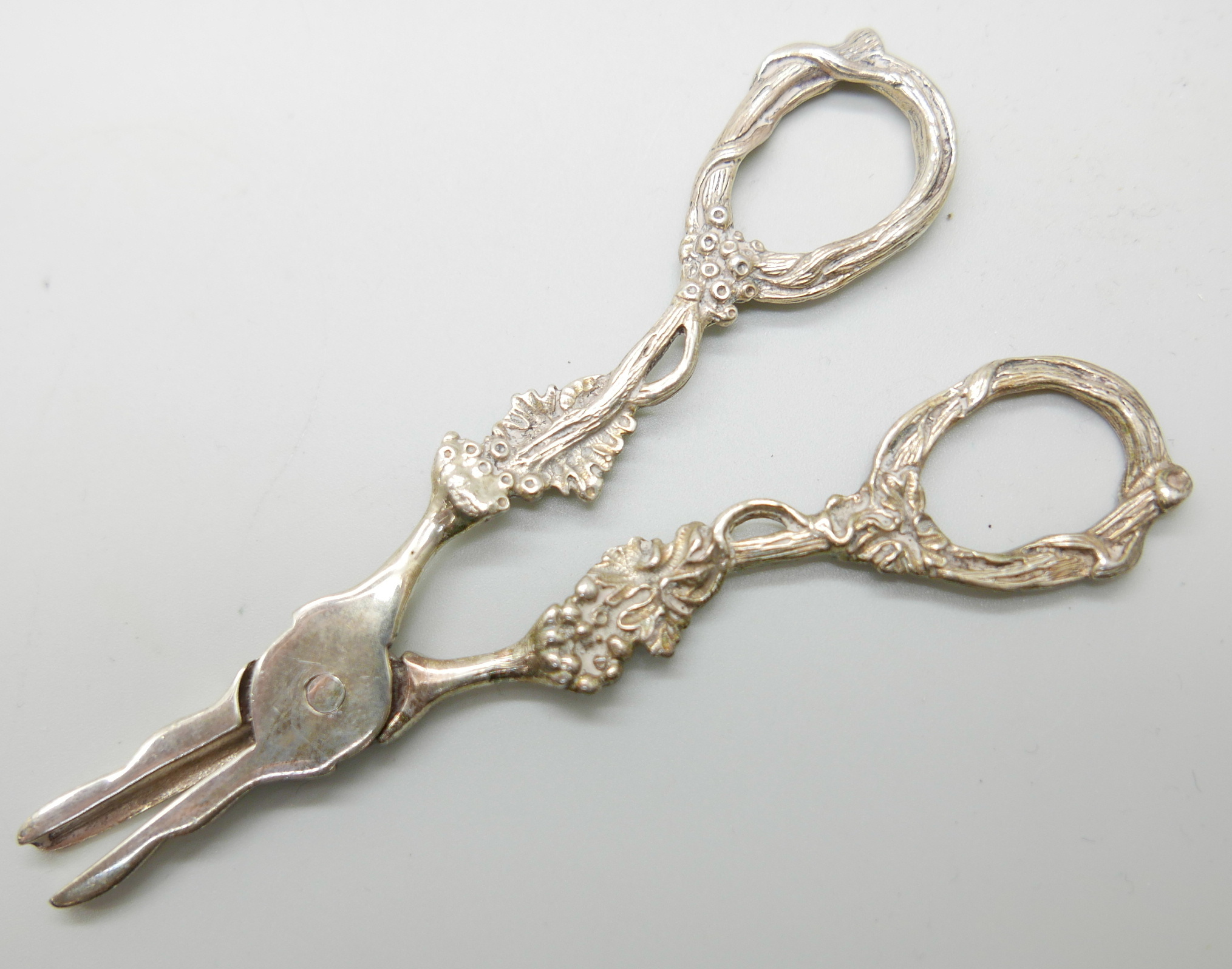 A Victorian silver spoon by George Adams, a strainer and a pair of silver grape scissors, (spoon and - Image 5 of 6