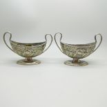 A pair of embossed silver salts, Henry Matthews, Birmingham 1902, a/f, 128.9g