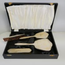A silver vanity set, Adie Bros., with a case