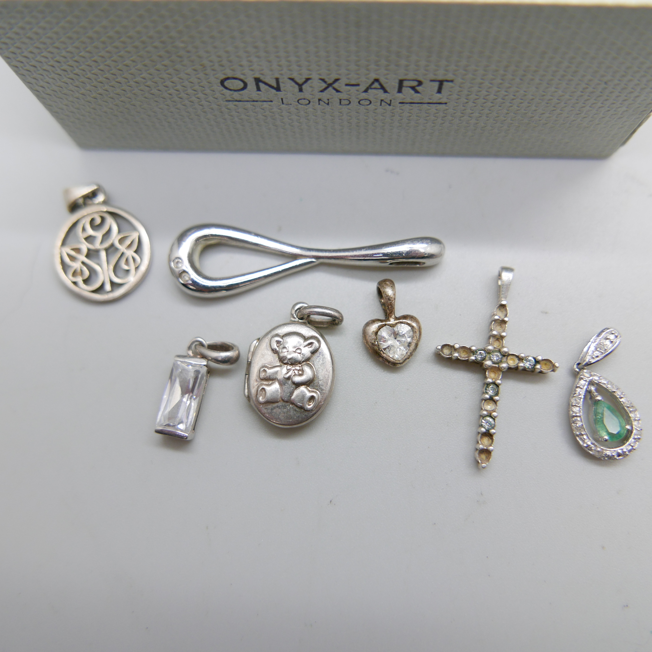 A pair of silver cufflinks and seven silver pendants, (cross lacking stones) - Image 2 of 2