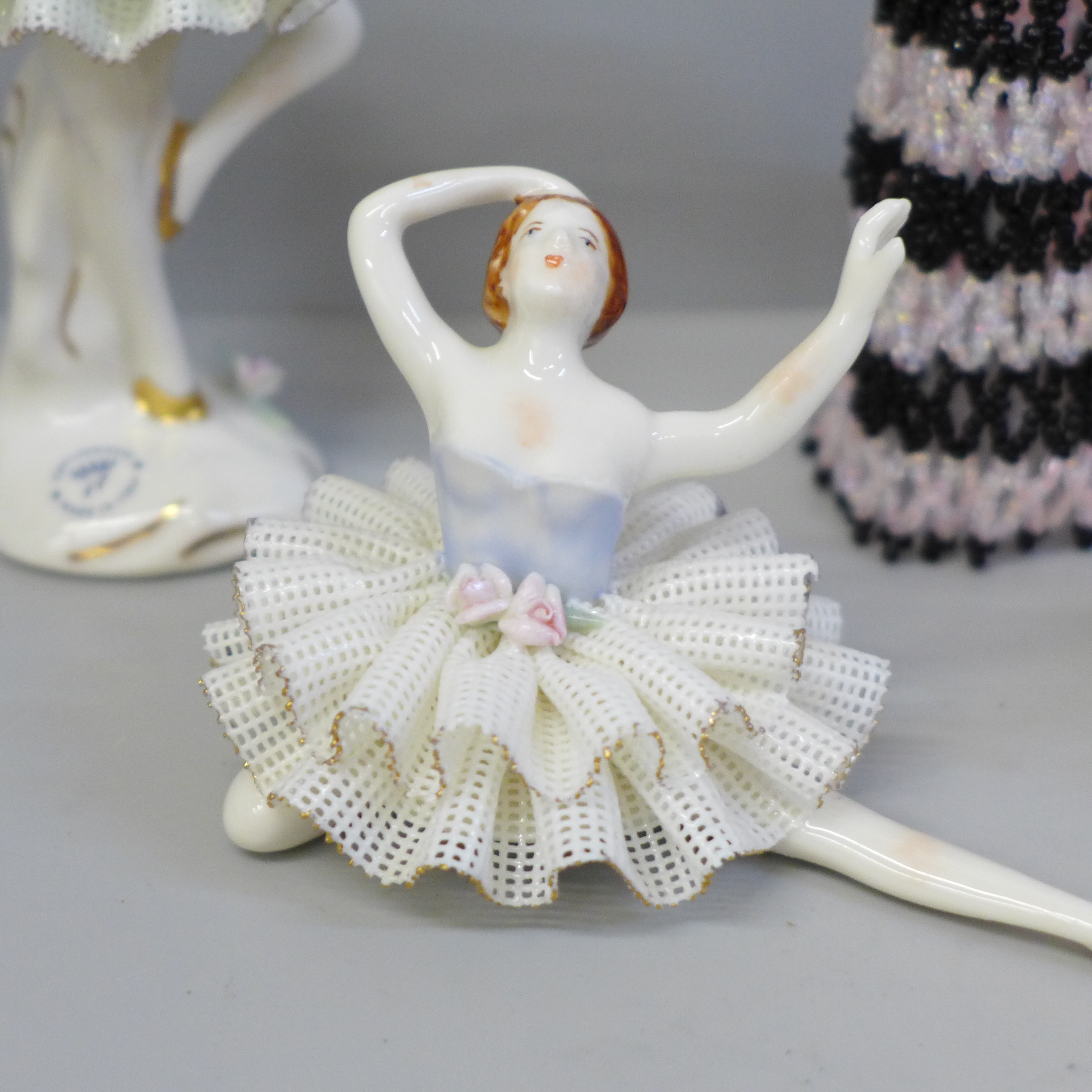 An Irish Dresden Pamela figure; three Capodimonte ballet dancer figures and a beaded lady in dress - Image 2 of 3