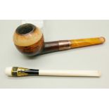 A smoker's pipe with a 9ct gold collar and a cigarette holder, both cased