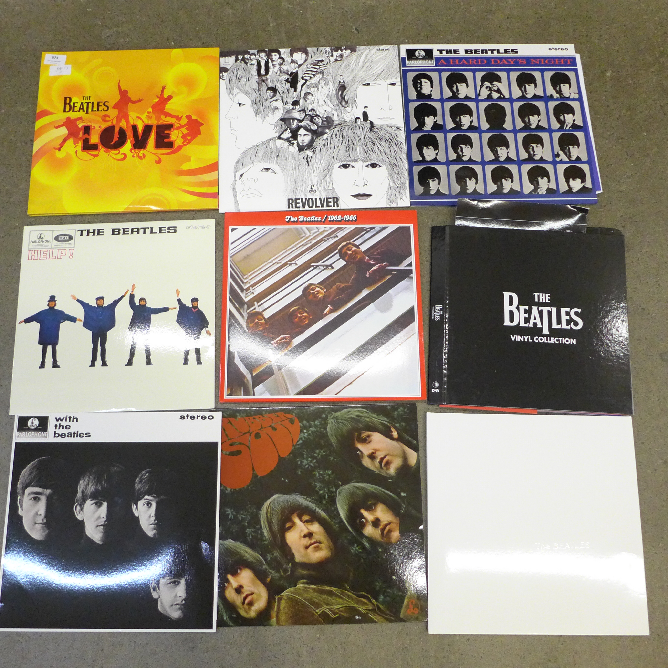 Twelve The Beatles LP records, re-issues, in VG condition, (Revolver x2 and Love album) folder and