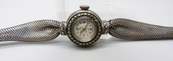 A silver cocktail wristwatch
