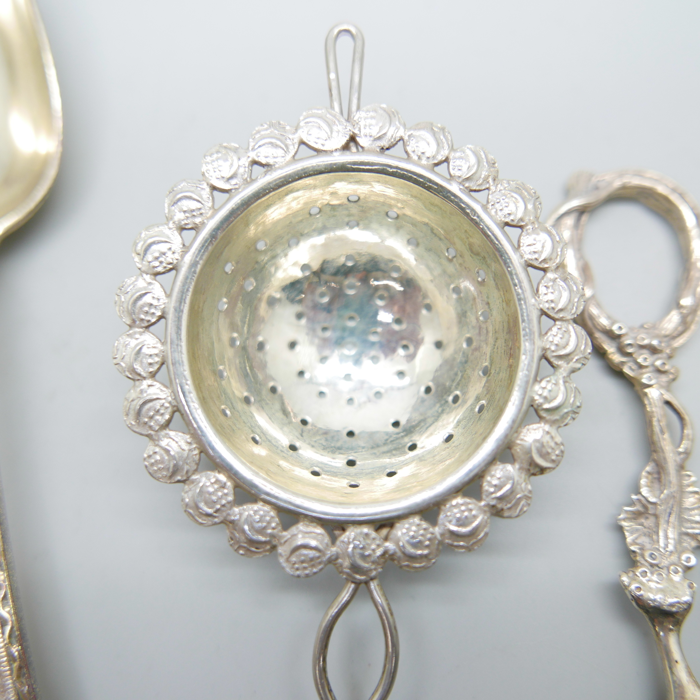 A Victorian silver spoon by George Adams, a strainer and a pair of silver grape scissors, (spoon and - Image 2 of 6