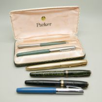 A cased Parker pen set, three other Parker pens and a Sheaffer