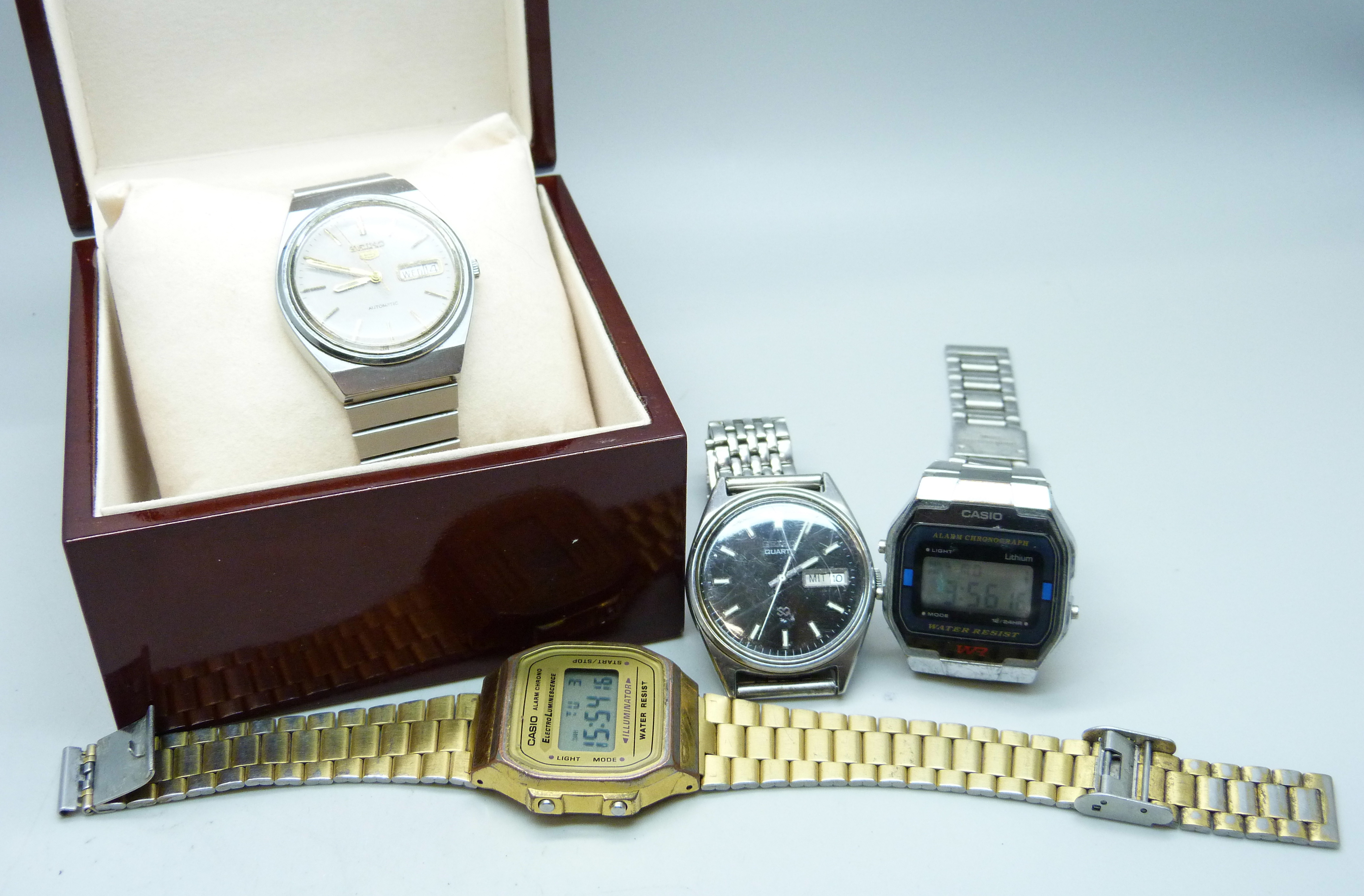 Four wristwatches, two Casio, Seiko 5 automatic and Seiko quartz