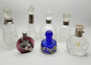 Seven scent bottles including silver mounted, one a/f