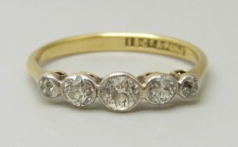 An 18ct gold and five stone diamond ring, all stones old cut, centre stone measures approximately